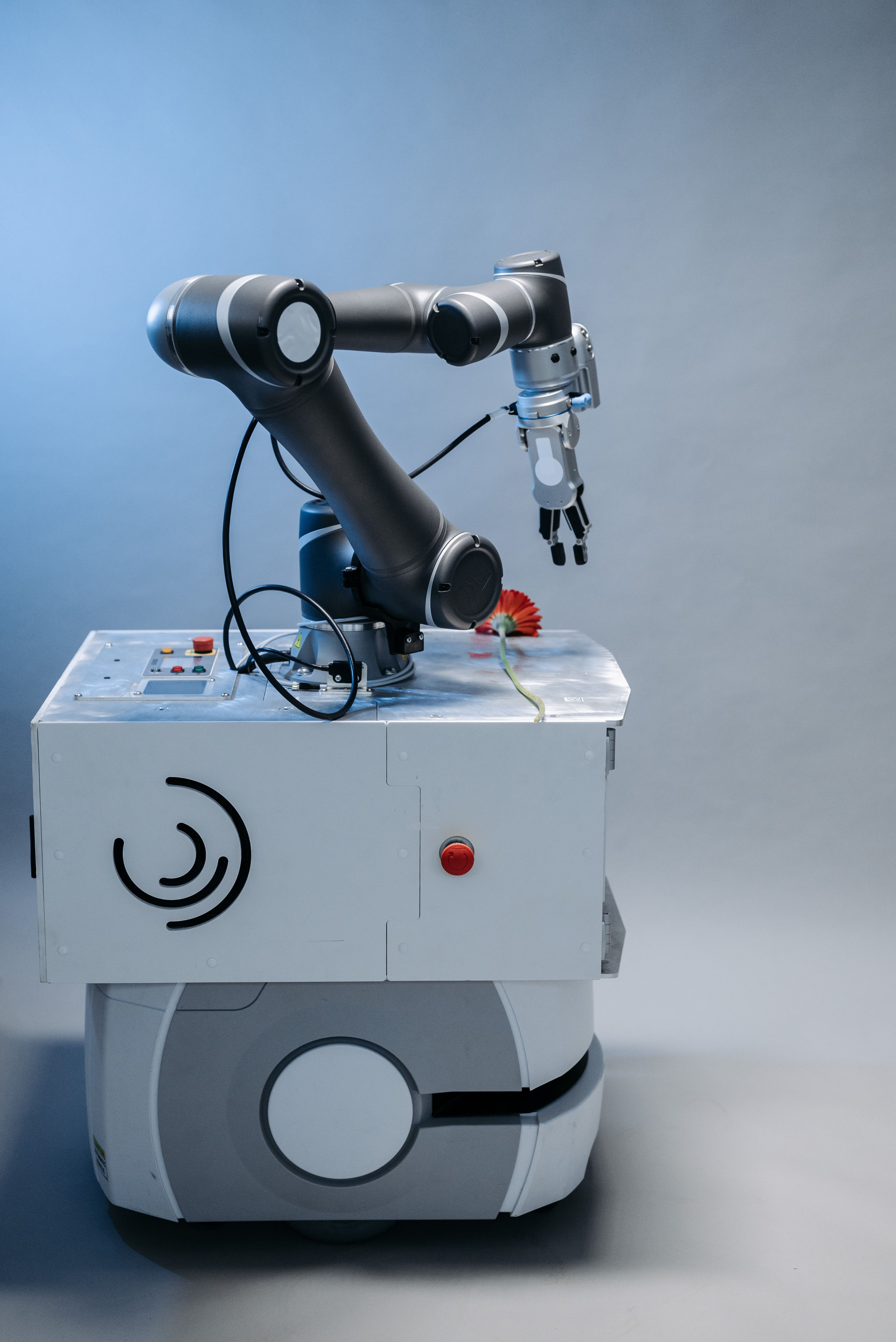 A robot arm operating in a lab, illustrating a system that acts on its own