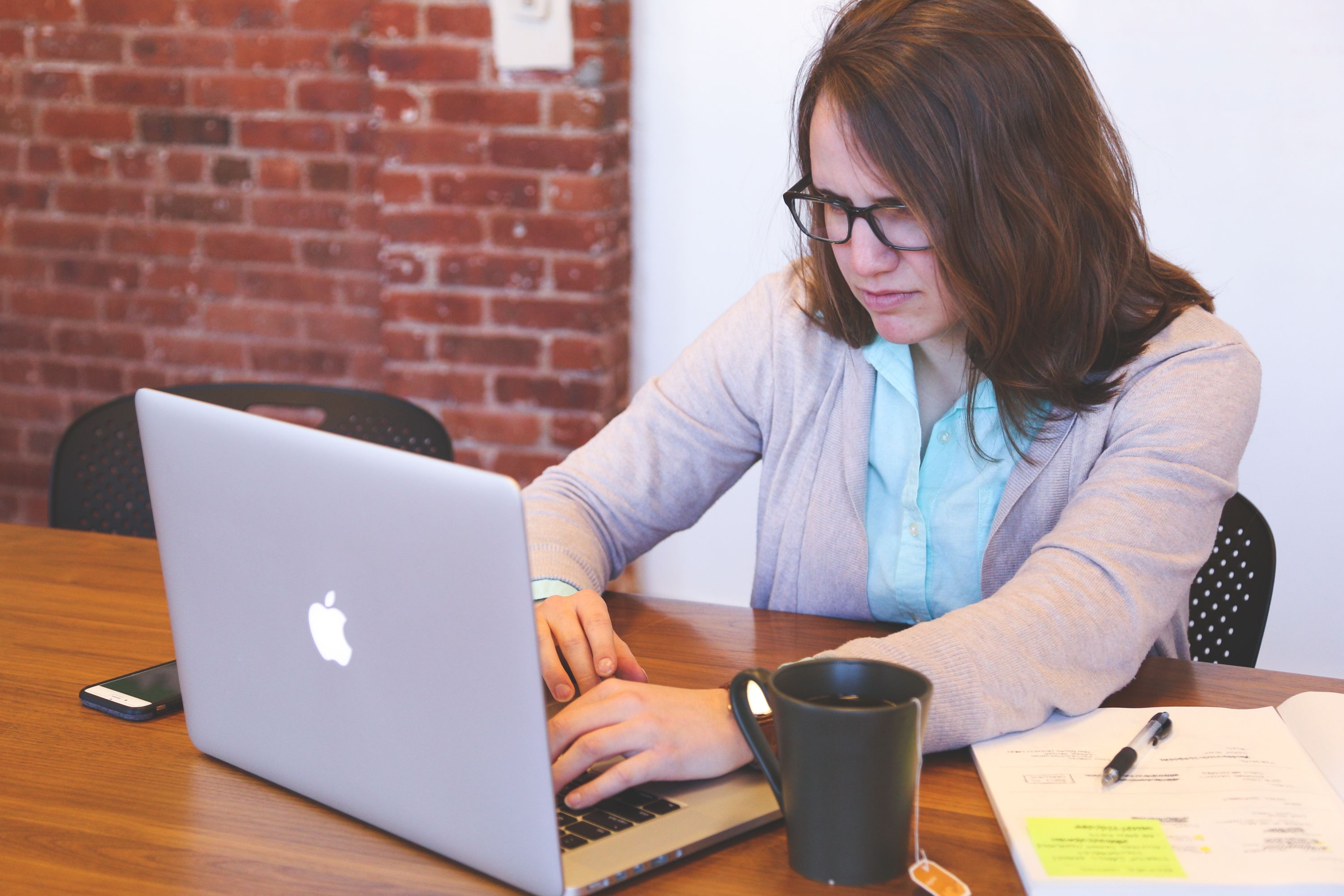 A person working alone at a laptop, representing a solo founder deciding which AI tools to rely on
