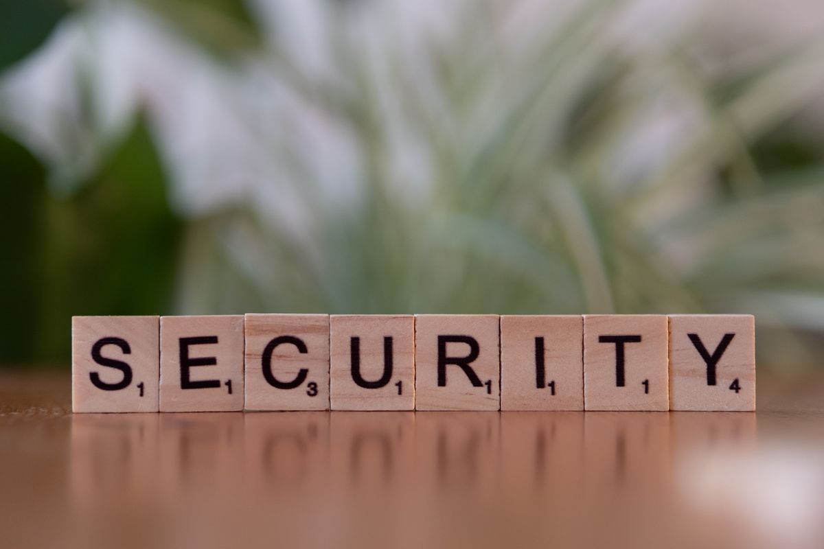 Wooden Scrabble tiles spelling out the word SECURITY on a table