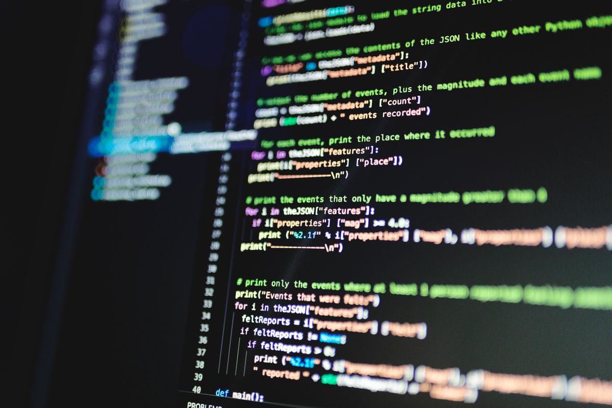 A monitor displaying lines of programming code, representing a technical security patch