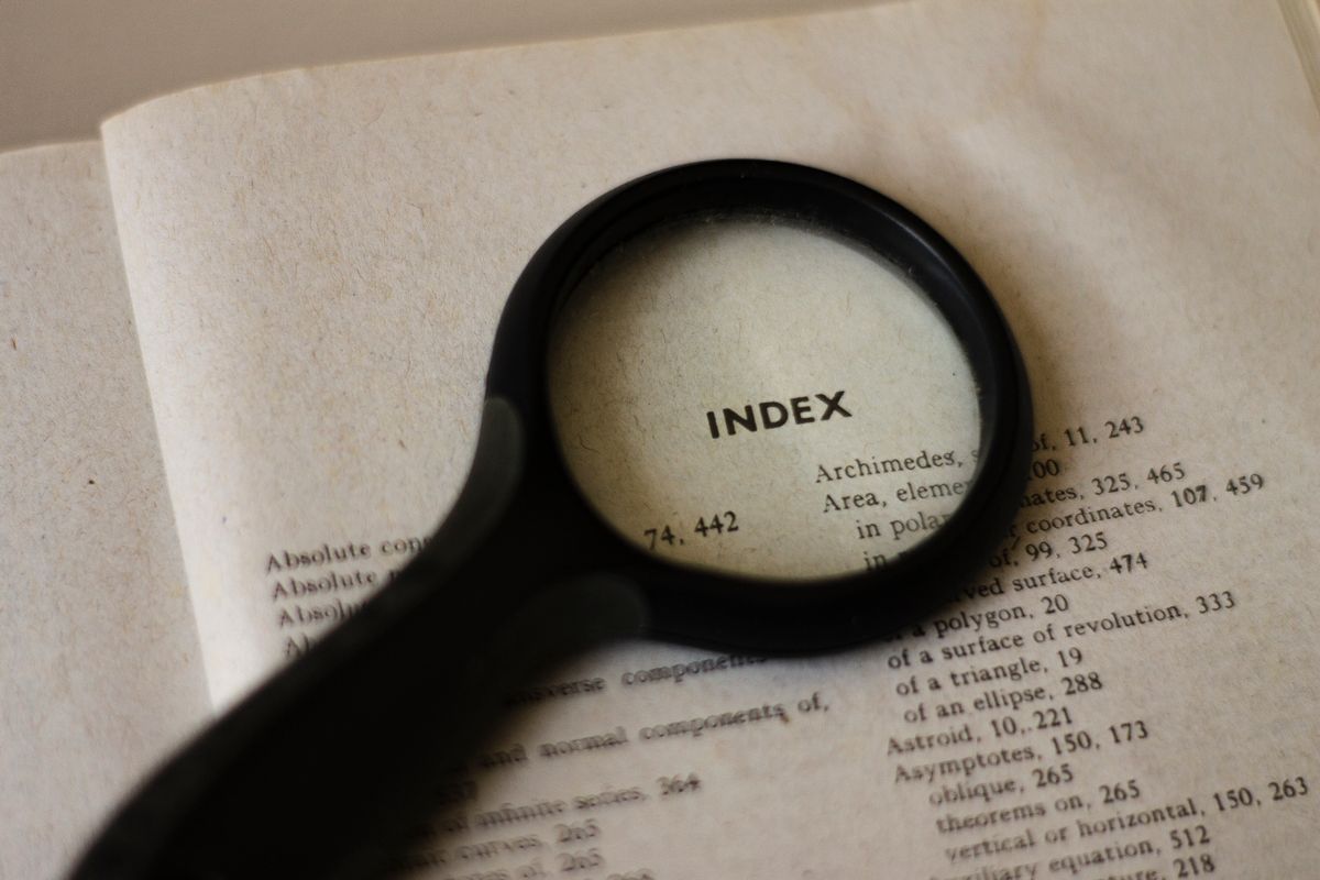 A magnifying glass held over a page of text